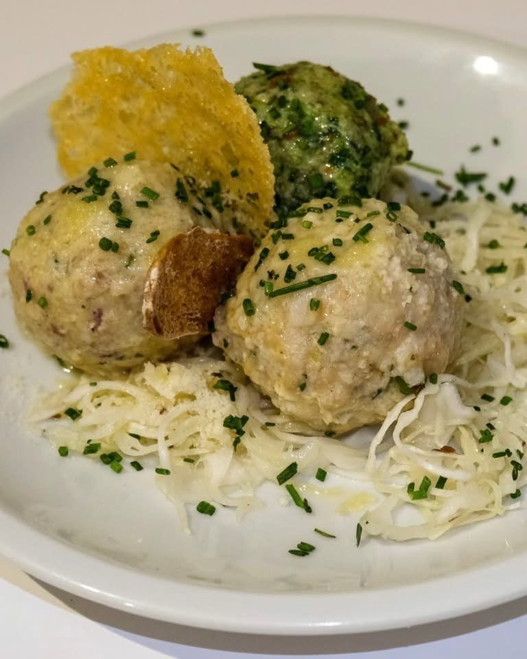 Tris di canederli con cappucci